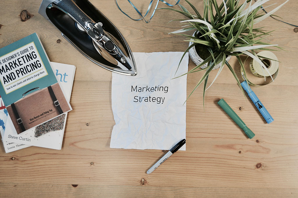 Marketing books and materials sits on a table